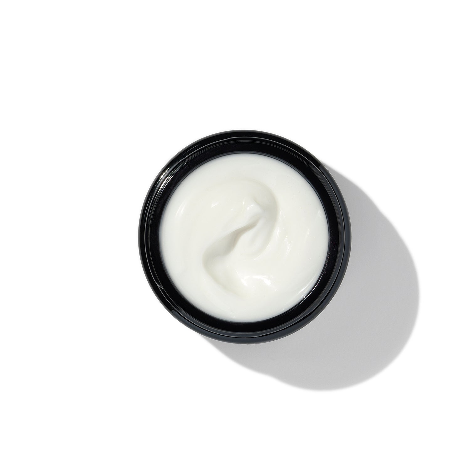 Texture of BL+ The Cream showing smooth white cream in open jar