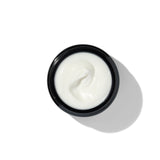 Texture of BL+ The Cream showing smooth white cream in open jar
