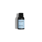 Conditioner travel size bottle on white background 