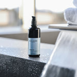 Body Oil bottle 3.4oz on stone surface