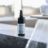 Body Oil bottle 3.4oz on stone surface