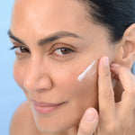 Model applying BL+ The Cream Light to the cheek