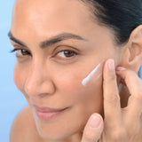 Model applying BL+ The Cream Light to the cheek