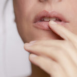 Close-up of model applying Lip Balm on