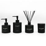 Hand Wash, Hand Lotion, Reed Diffuser and Candle arranged on white background